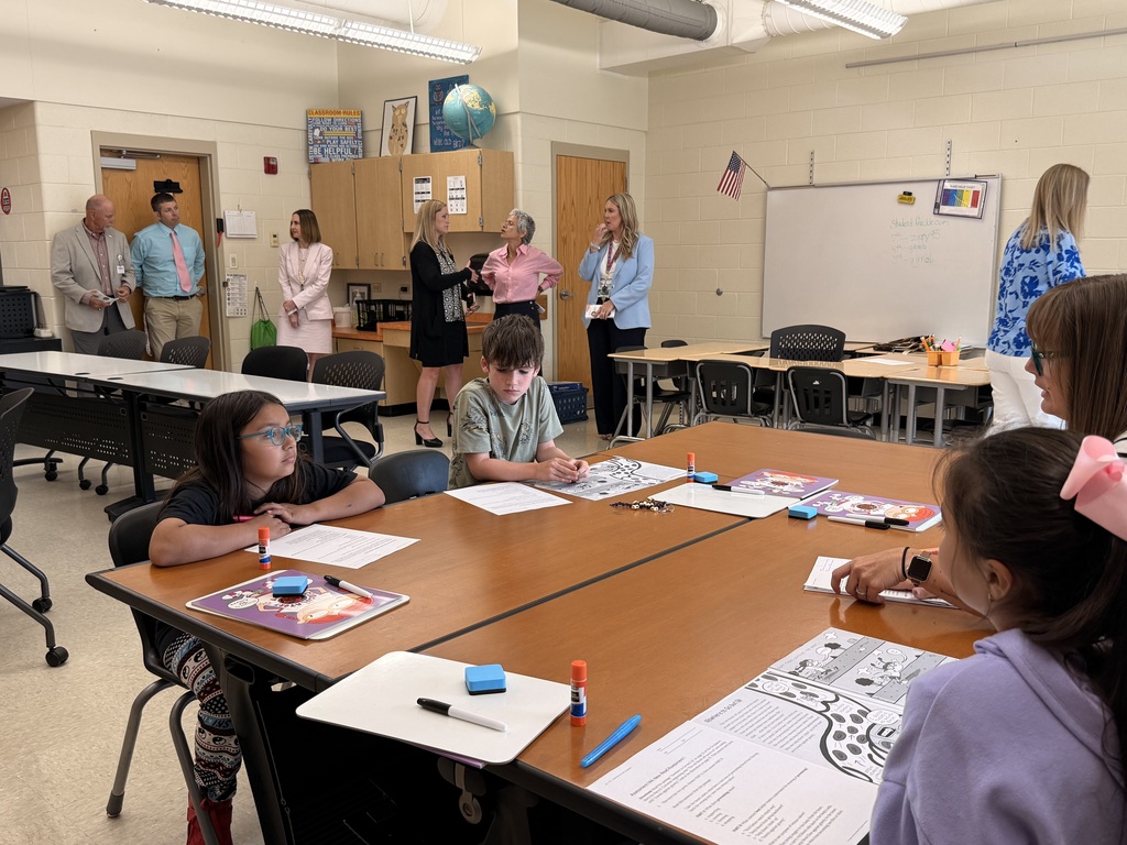 students participate in a hands-on summer STREAM lesson at Tennessee Middle School while Tennessee Department of Education Commissioner Lizzette Reynolds, department staff, and Bristol Tennessee City Schools leaders observe from the back of the classroom during a district visit. Students work with instructional materials and collaborate around tables as visitors watch the lesson in progress.