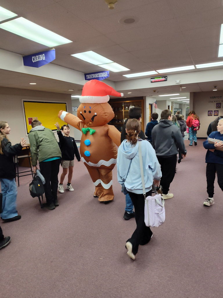 Gingersnap greets students. 