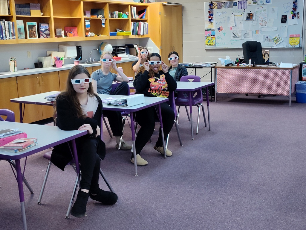 Pictures of students trying on Civil War era clothing