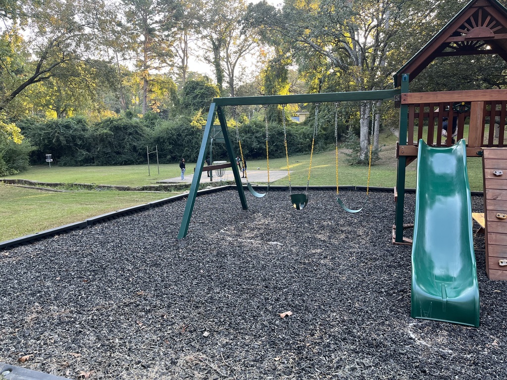 Kids enjoying basketball hoops and playground