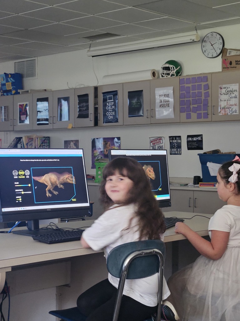 Girls designing dinosaurs