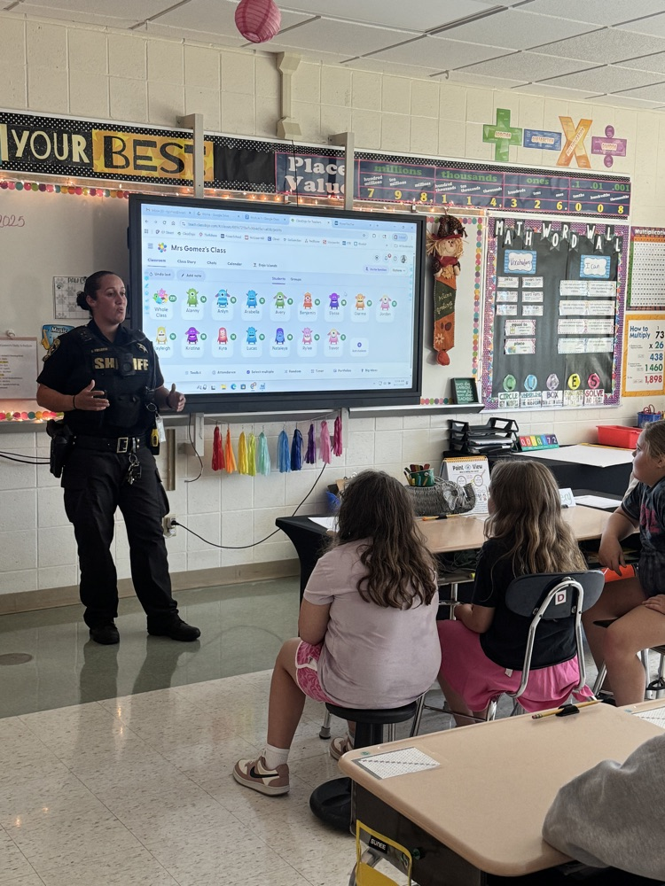 Officer Rosario teaches 5th Graders about how Kevlar protects officers while on duty.
