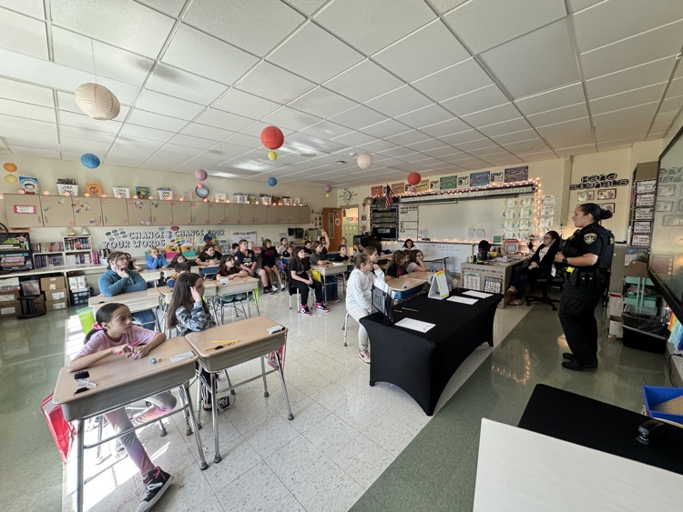 Officer Rosario teaches 5th Graders about how Kevlar protects officers while on duty.