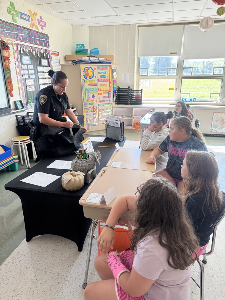 Officer Rosario teaches 5th Graders about how Kevlar protects officers while on duty.