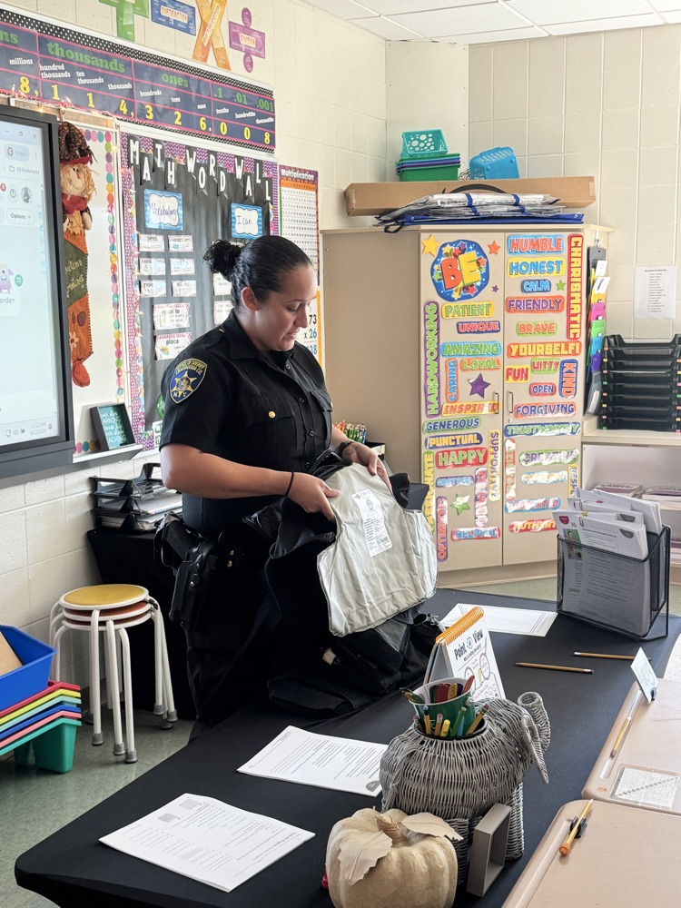 Officer Rosario teaches 5th Graders about how Kevlar protects officers while on duty.
