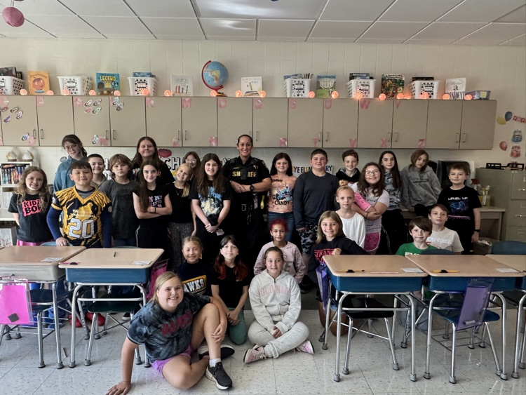 Officer Rosario teaches 5th Graders about how Kevlar protects officers while on duty .