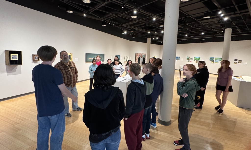 Students asking questions about Rey's life and work.