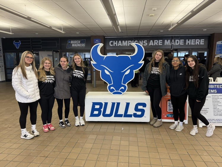the girls varsity basketball team with the UB Bull