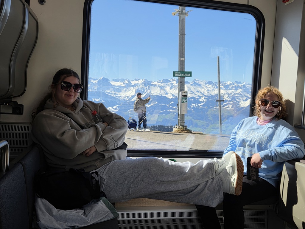 Students on a carriage into the Alps