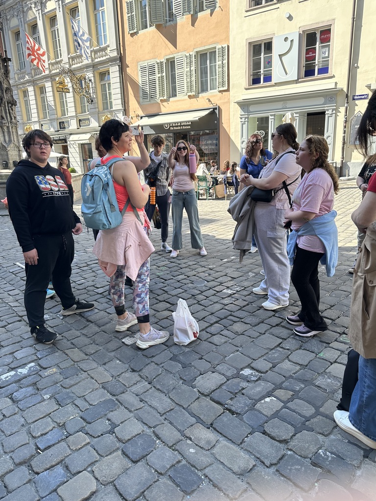 Students listening to a tour guide in Lucerne