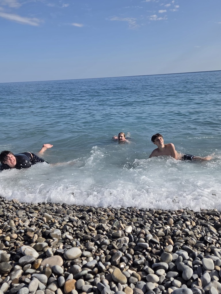 Students splash in the Mediterranean Sea in Nice, in the south of France
