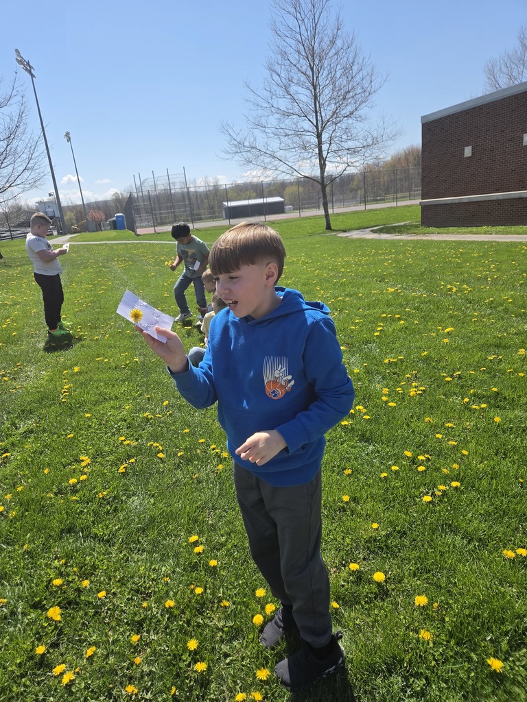 Student in dandelions