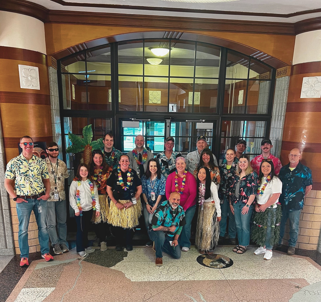 Middle/High School Staff wearing Hawaiian shirts with the construction crew