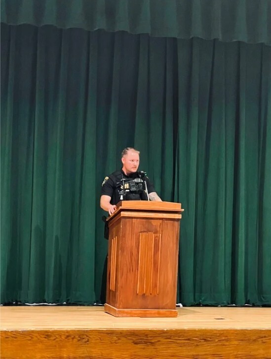 deputy talking to students