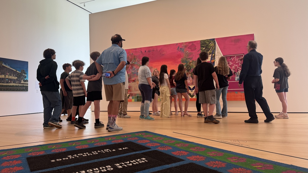 Students enjoy looking at art work. 