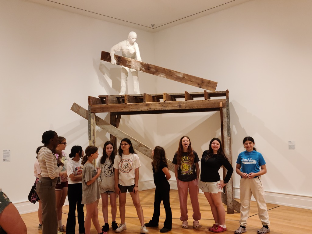 Students enjoy looking at art work. 
