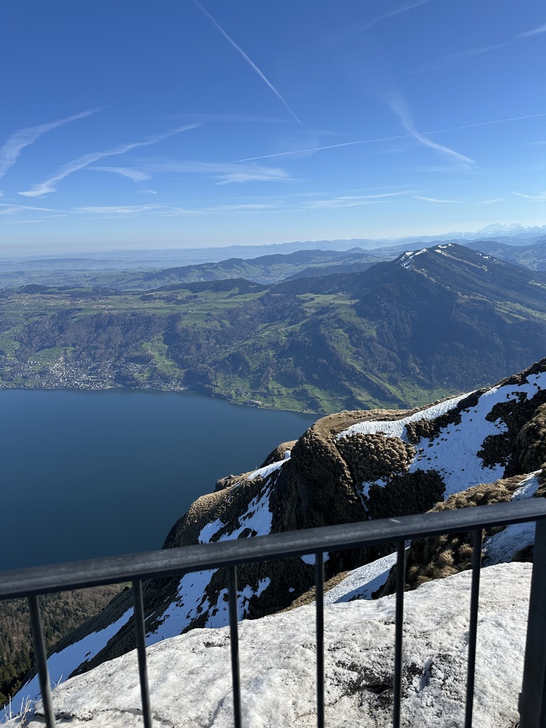 A valley, lake, and countryside from atop a mountain