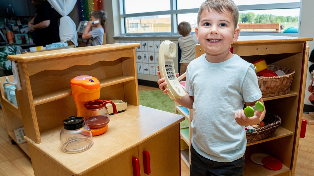 Picture of Pre-K student playing inside.