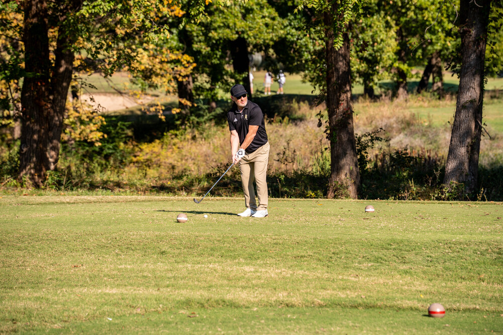 Superintendent Chuck Perry playing golf in the annual BAPS Foundation Golf Tournament.