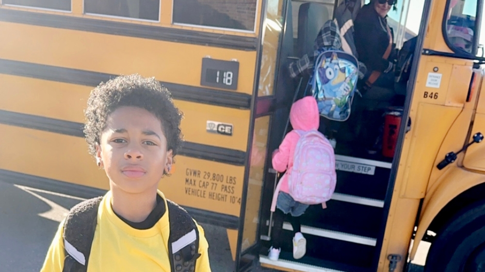 Students getting on the bus.