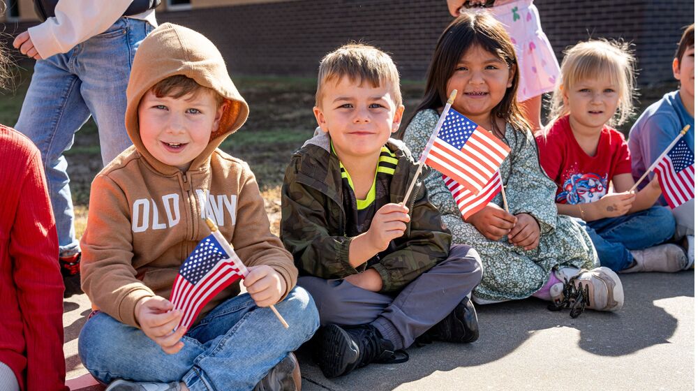 Students Holding Flag