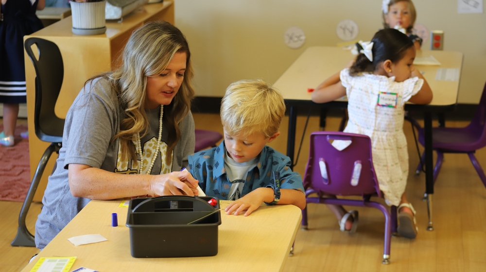 Picture of kindergarten students reading book.
