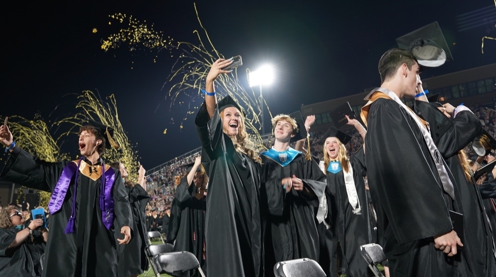 Students celebrating their graduation.