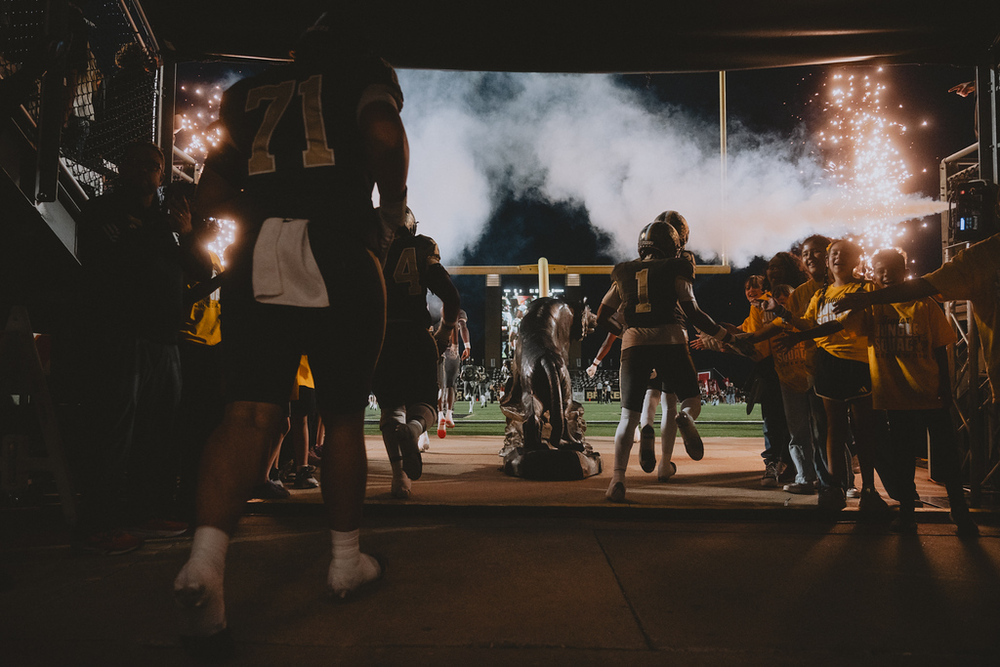 Football Players walking out of the tunnel