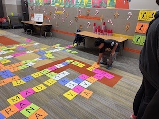 Students used the tiles to create words in a enormous crossword!