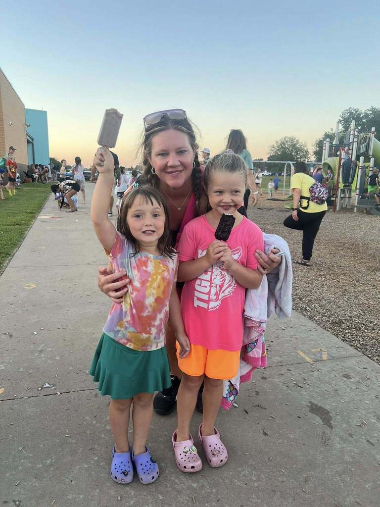 Mom and daughters at school event