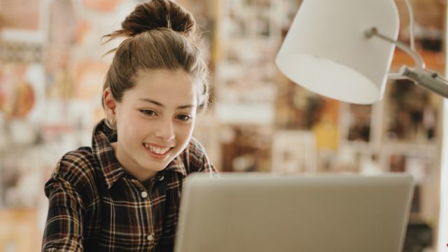 Image of student on computer.