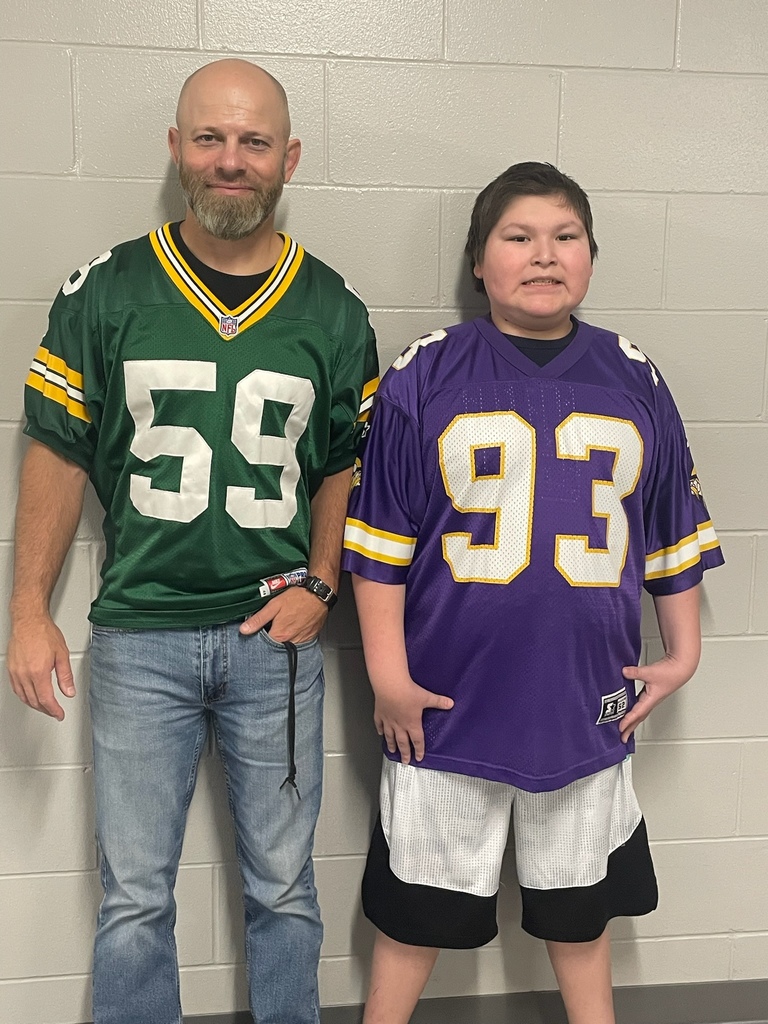 staff in Packers jersey and student in Vikings jersey.