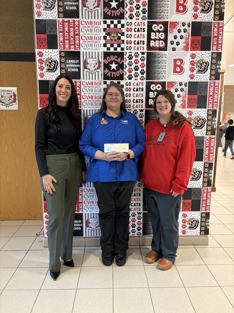Dr. Vaux, VFW Auxiliary Rep Kristy, and Nurse Chantel receive check
