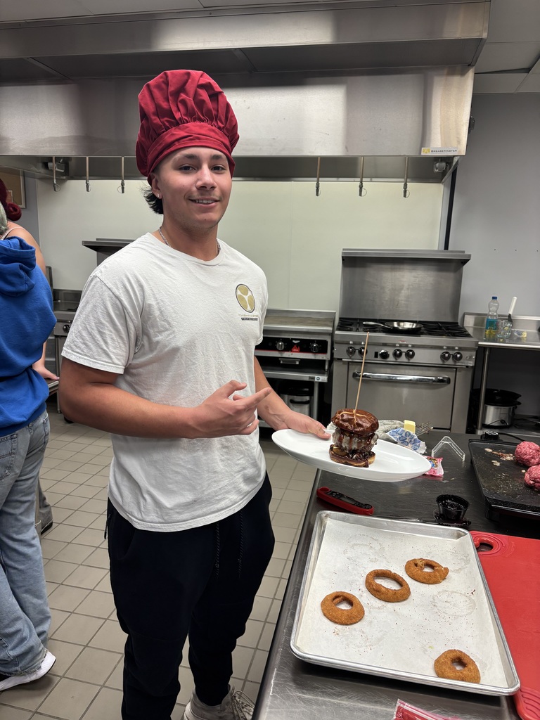 One student holding a hamburger