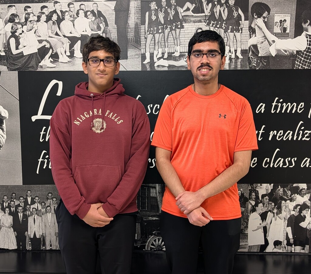 Two students standing