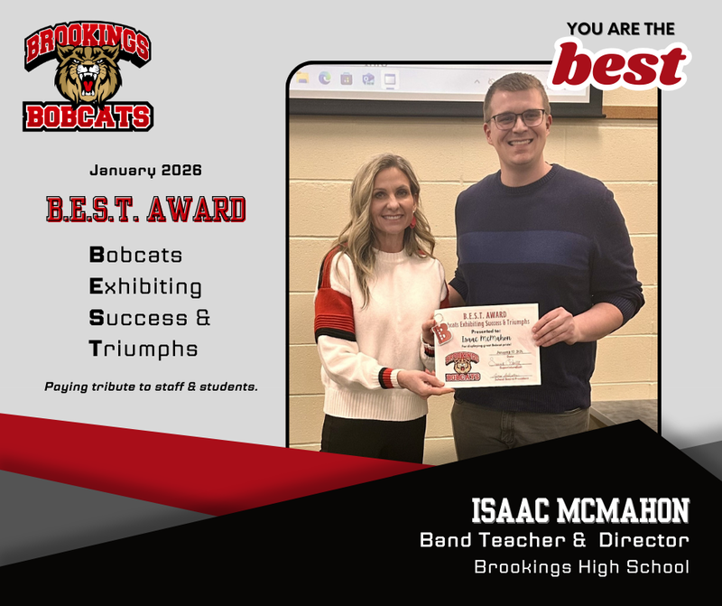 winner isaac mcmahon standing with superintendent schultz.