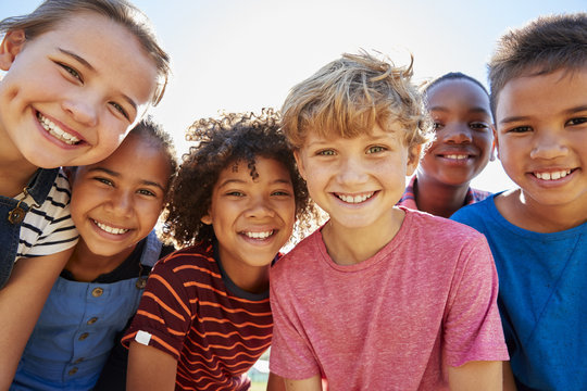 Group of children smiling into the camera
