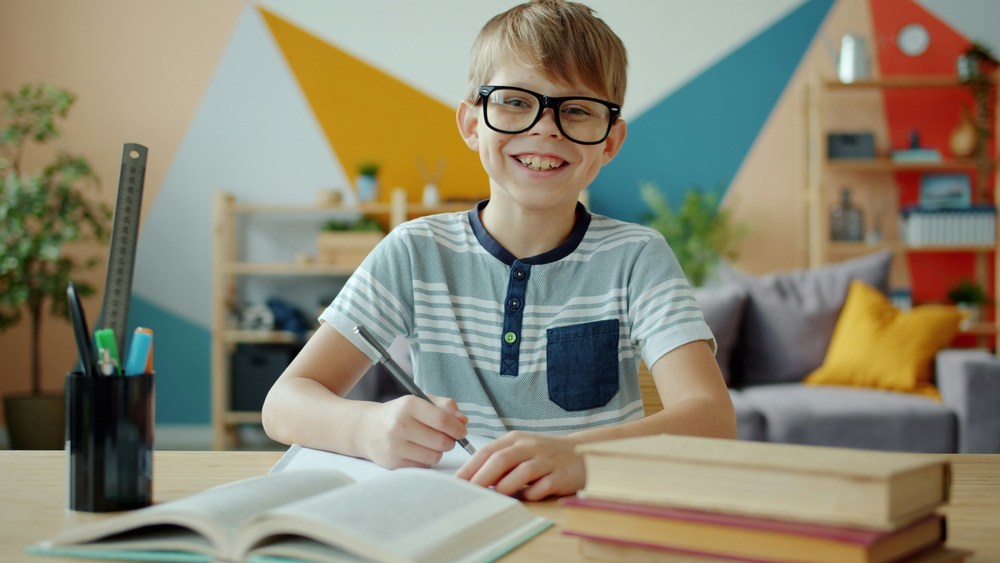 young boy with book