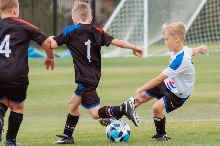 Students playing football 