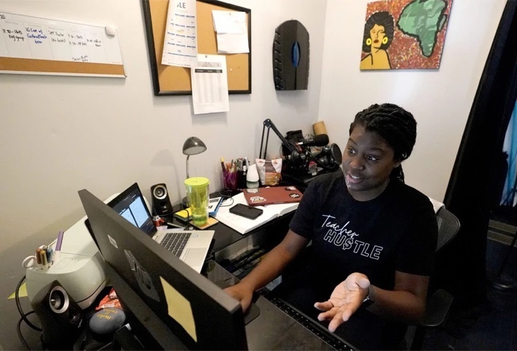 women sitting at her desk in an office