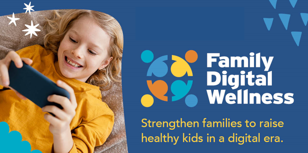 A girl watching her phone with a big grin laying on her back. A text next to her saying "Family Digital Wellness Strengthen families to raise healthy kids in a digital era""