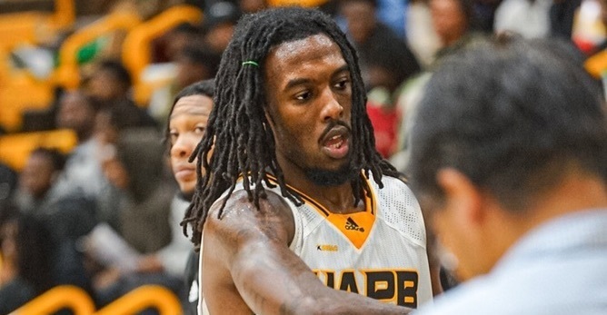 UAPB guard Rashad Williams shaking teammates hands