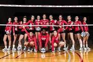 volleyball team in front of net
