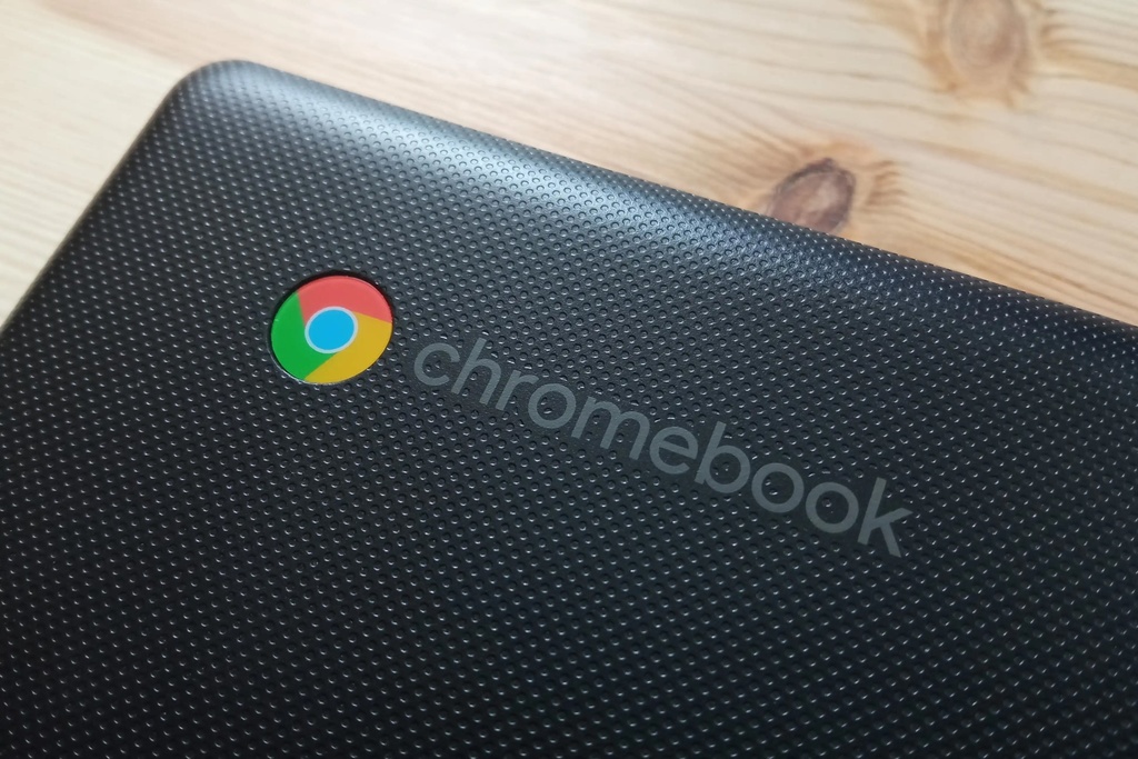 Photo of the corner of a chromebook focusing on the logo.