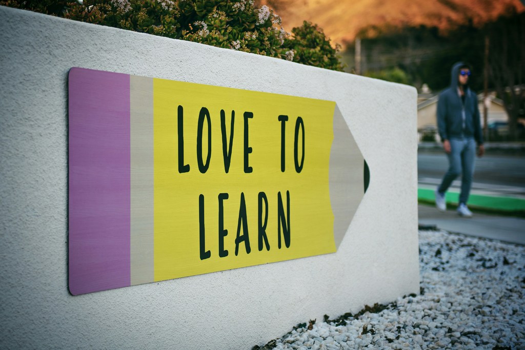 sign that reads "Love to Learn"