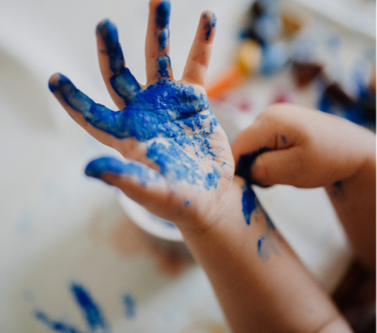 kids adding paint to hands
