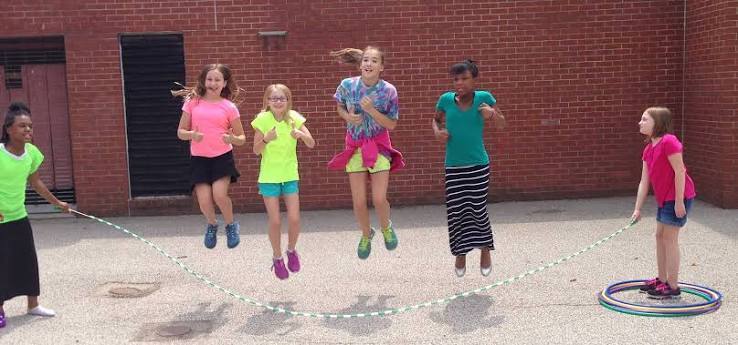 Students jumping rope playing at recess