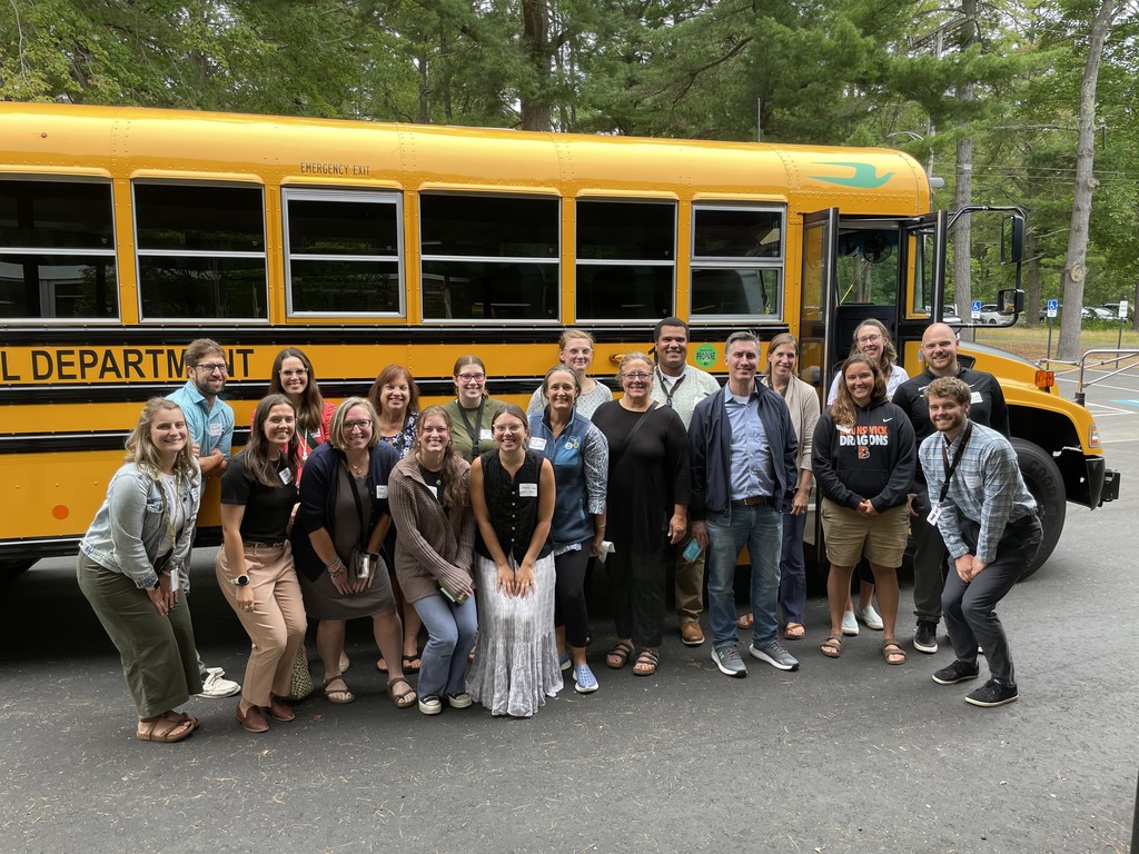 New Staff In Front of School Bus