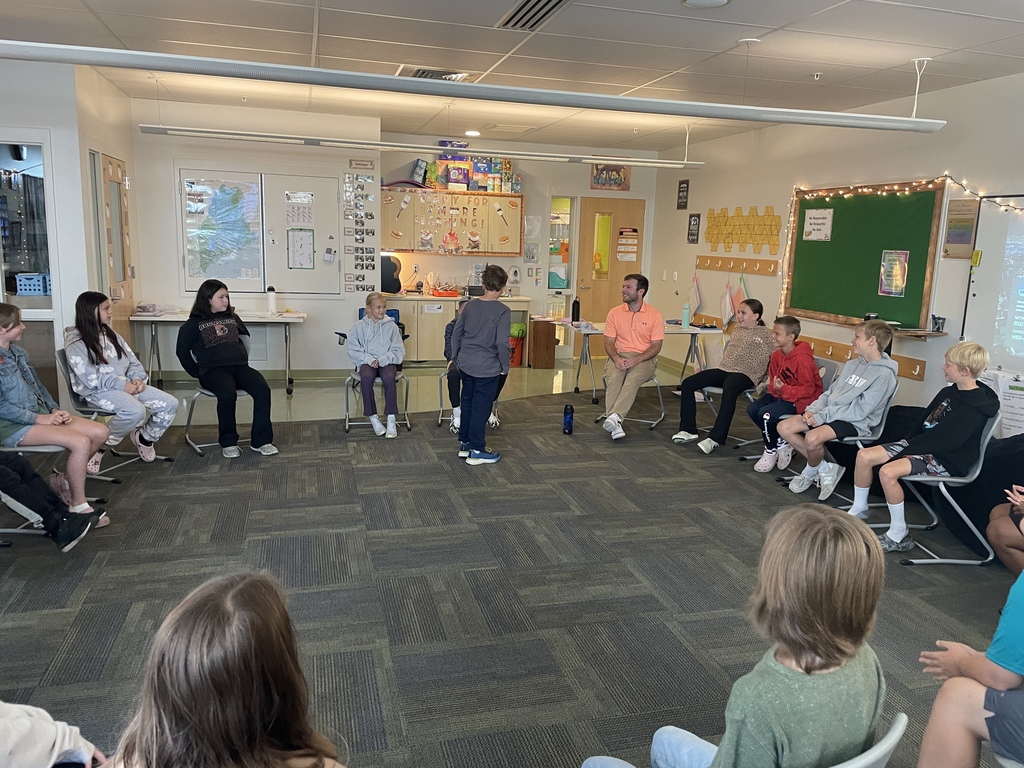 students sitting in a circle