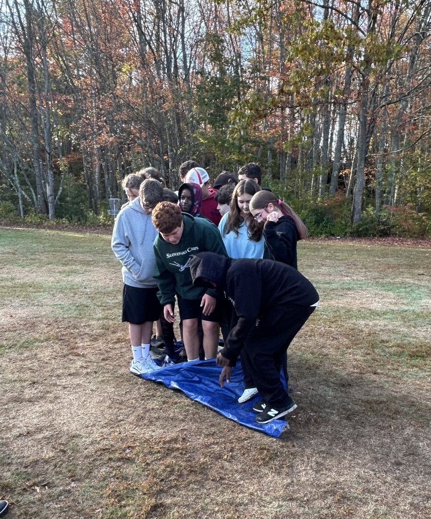 Students outside on a tarp.